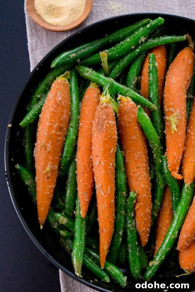 Sautéed Carrots and Green Beans with Garlic and Herbs 3 overhead close up shot of black bowl with carrots and green beans