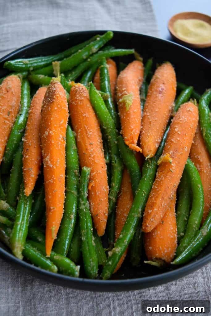 Sautéed Carrots and Green Beans with Garlic and Herbs 6 close up view of carrots and green beans coated in garlic and onion powder