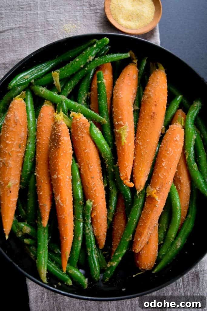 Sautéed Carrots and Green Beans with Garlic and Herbs 7 overhead shot of black bowl with sautéed carrots and green beans