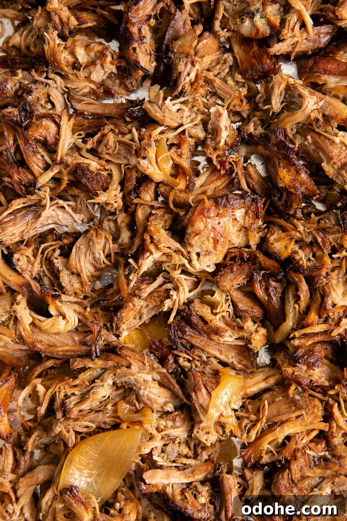 40+ Authentic Mexican Recipes for an Unforgettable Cinco de Mayo 12 Shredded crispy pulled pork carnitas on a large baking sheet.