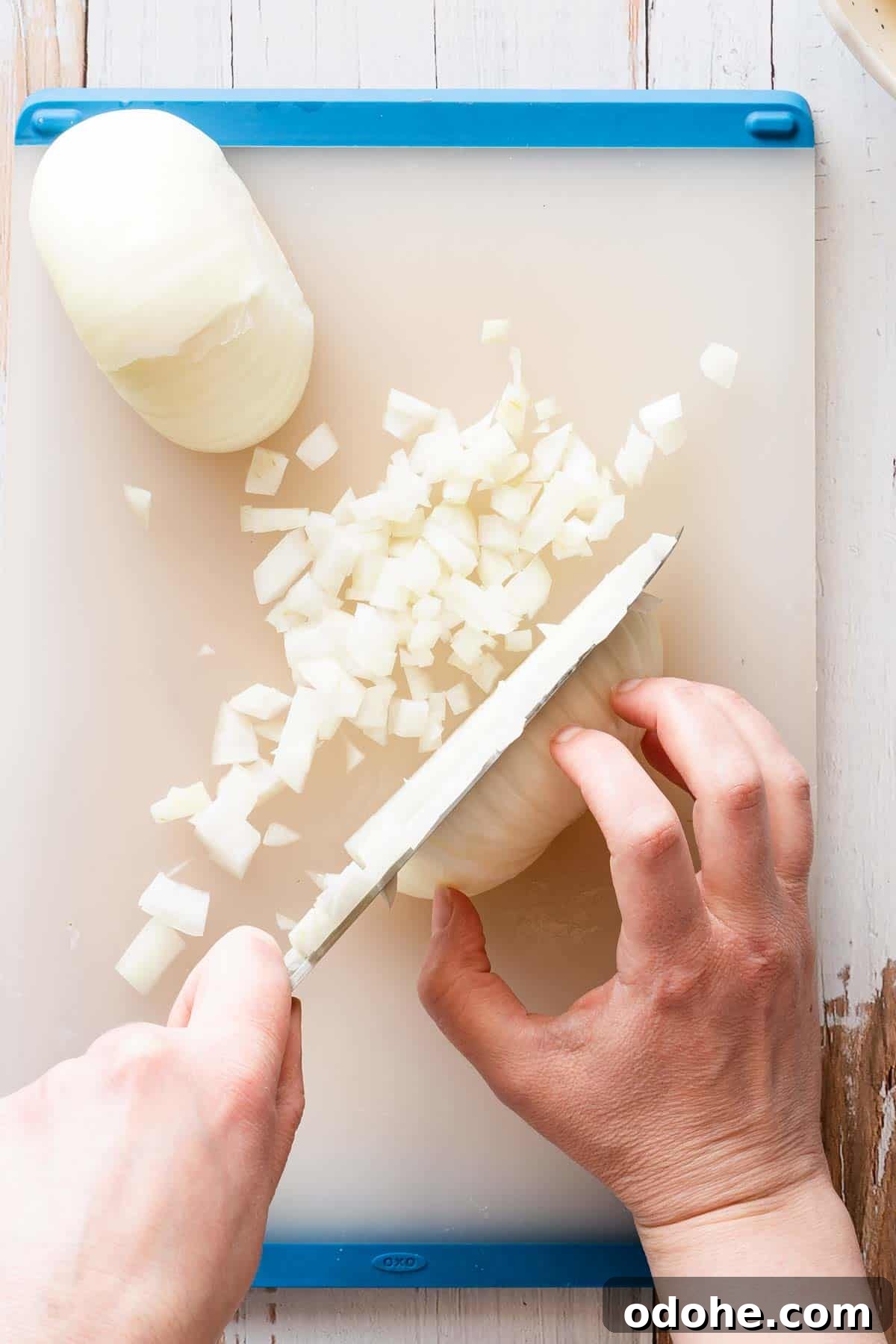 onion being diced on cutting board.