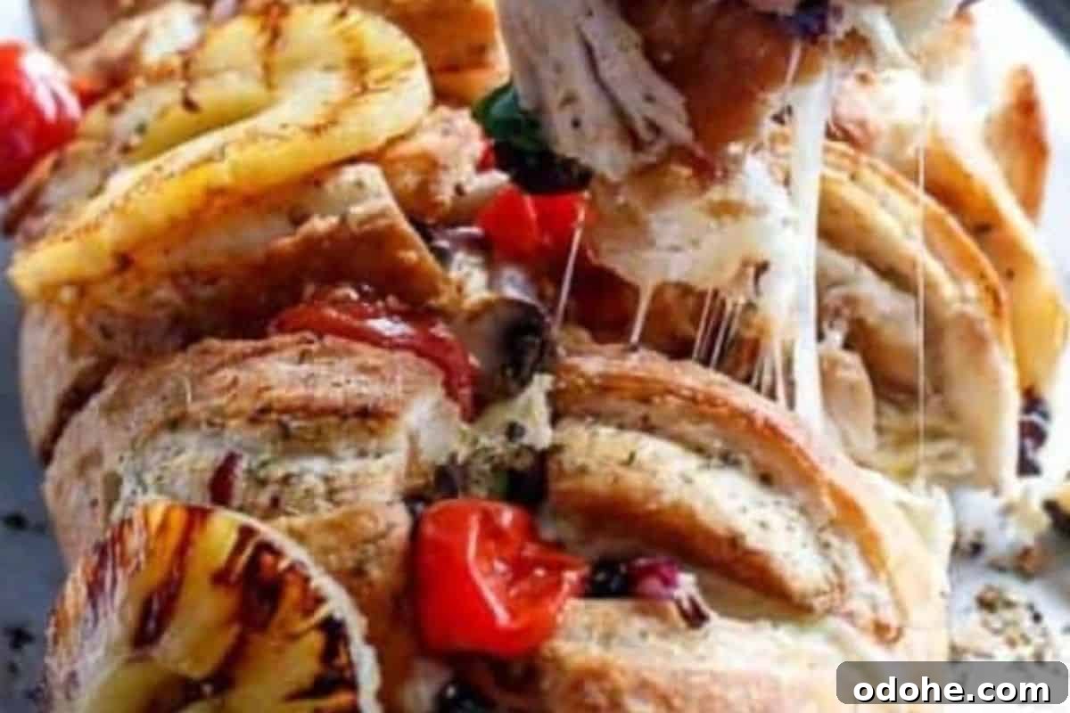 Smoky BBQ Chicken-Stuffed Bread Recipe: Savory Pull-Apart Loaf 11 Top with the grilled pineapple and tomatoes, and finish with fresh shredded basil before serving.
