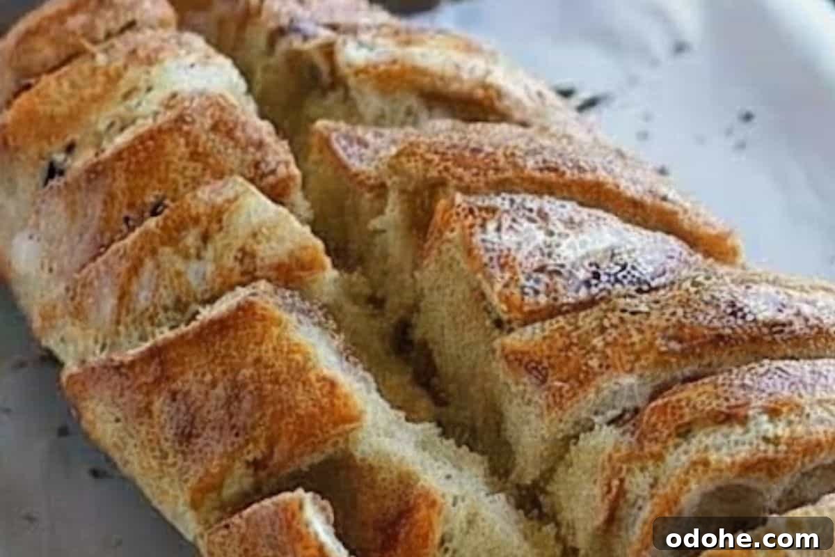 Smoky BBQ Chicken-Stuffed Bread Recipe: Savory Pull-Apart Loaf 5 Use a bread knife to cut lengthwise along the creases,