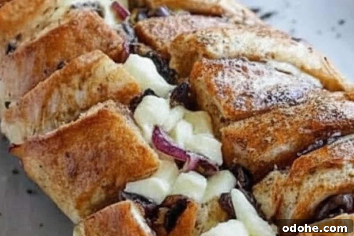 Smoky BBQ Chicken-Stuffed Bread Recipe: Savory Pull-Apart Loaf 7 Tuck the chicken, mozzarella, onions, olives, and mushrooms into all the cuts