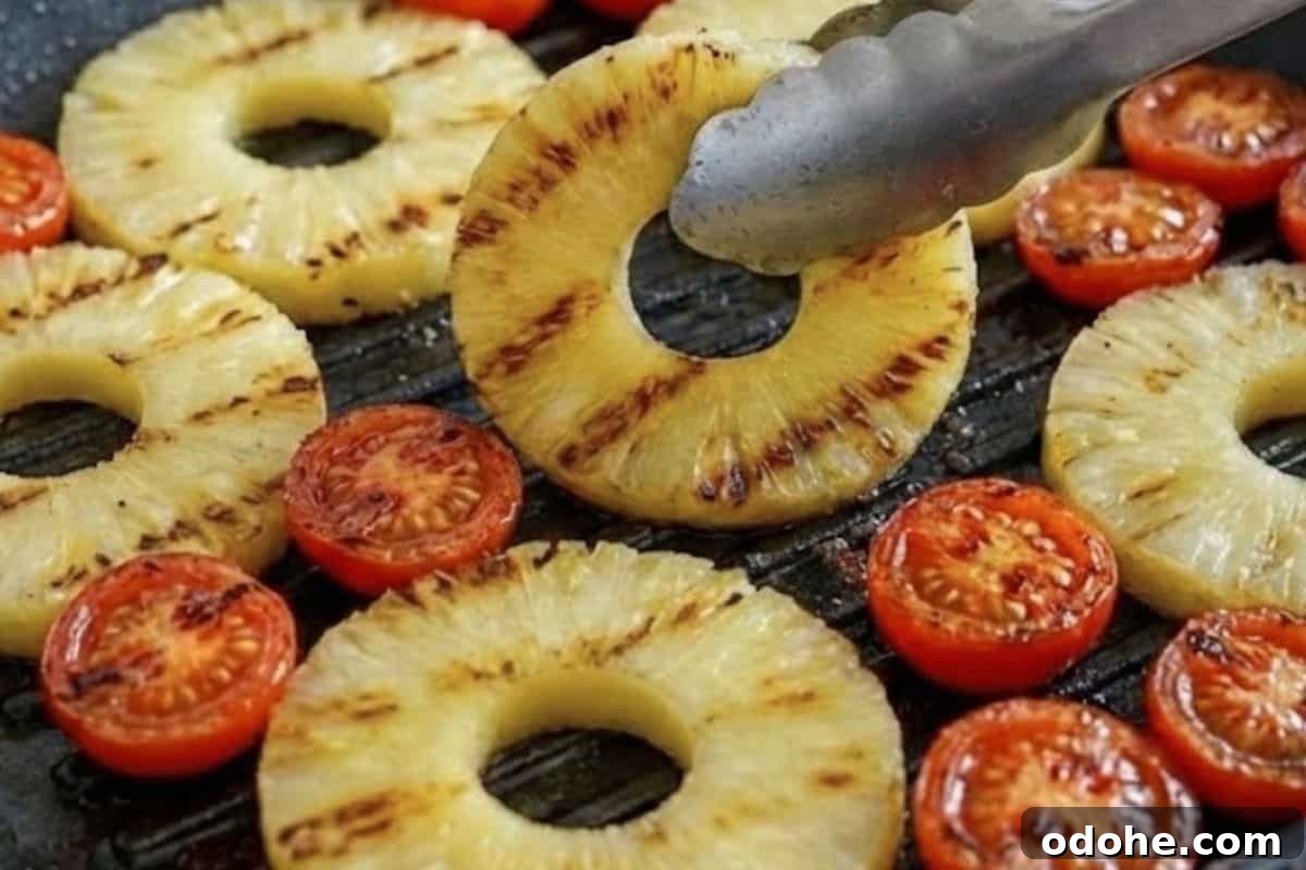 Smoky BBQ Chicken-Stuffed Bread Recipe: Savory Pull-Apart Loaf 10 While the bread bakes, grill the pineapple rings and cherry tomatoes