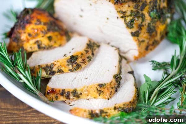 Herb-Butter Roasted Turkey Breast Recipe for Juicy Results 4 Herb Butter Roasted Turkey Breast Served with Cut Pieces of Flavorful Turkey