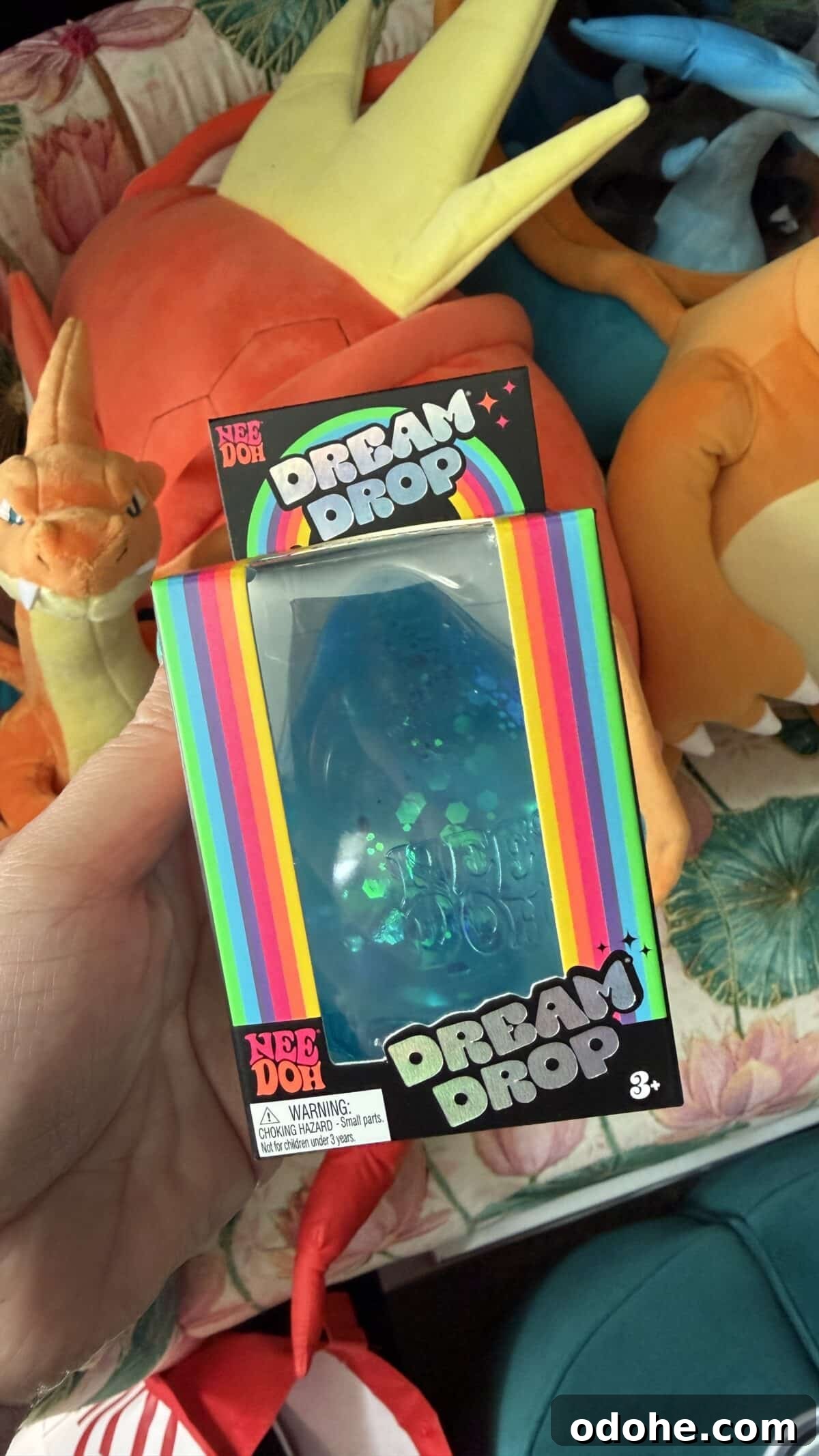 Where Parents Are Finding Sold-Out NeeDoh Squishies Right Now 6 woman's hand holding box of needoh dream drop