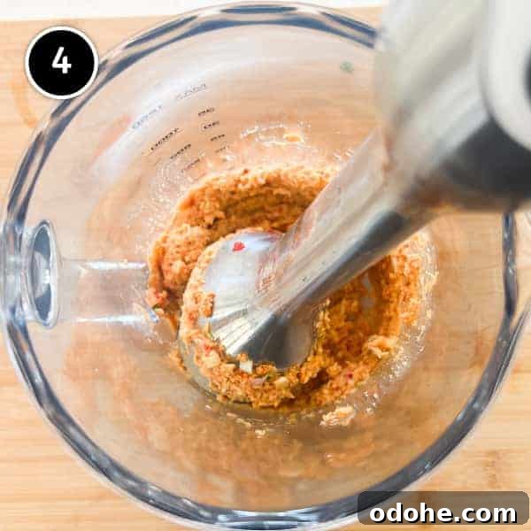 Thai Beef Massaman Curry | cookeatworld.com Fragrant ingredients being blended together for a Thai Massaman curry paste.