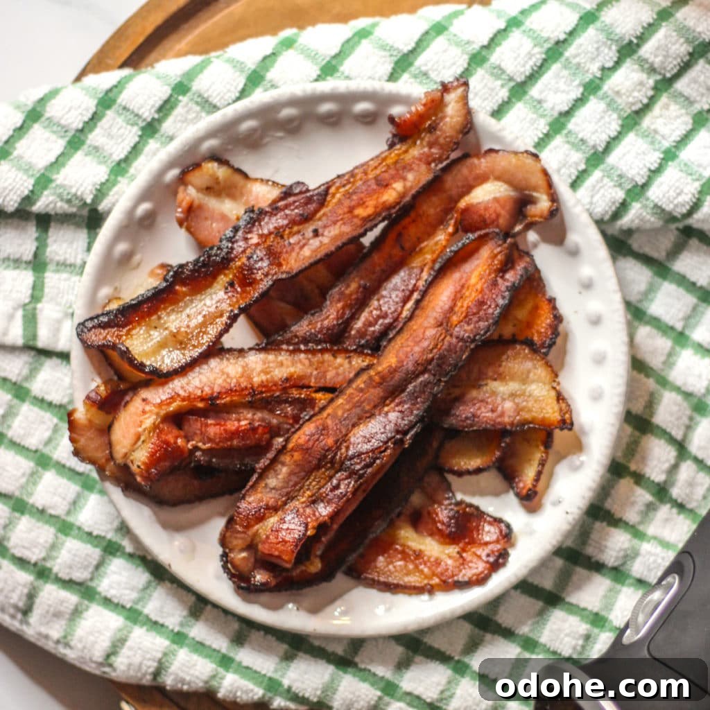 Overnight Sous Vide Bacon Recipe (Video Guide) 10 sous vide bacon crisped in a cast iron skillet