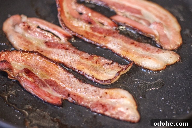 Overnight Sous Vide Bacon Recipe (Video Guide) 8 cooking sous vide bacon in a cast iron pan on medium-high to get a crispy finish