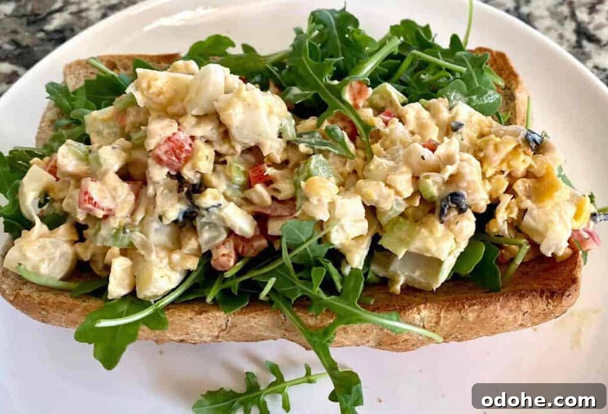 Hearts of Palm Vegan Lobster Roll Recipe 2 Hearts of palm lobster roll on a plate.