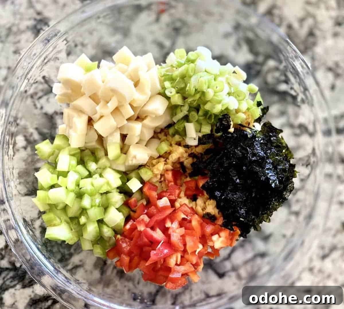 Hearts of Palm Vegan Lobster Roll Recipe 5 Lobster salad ingredients in a bowl on the table.