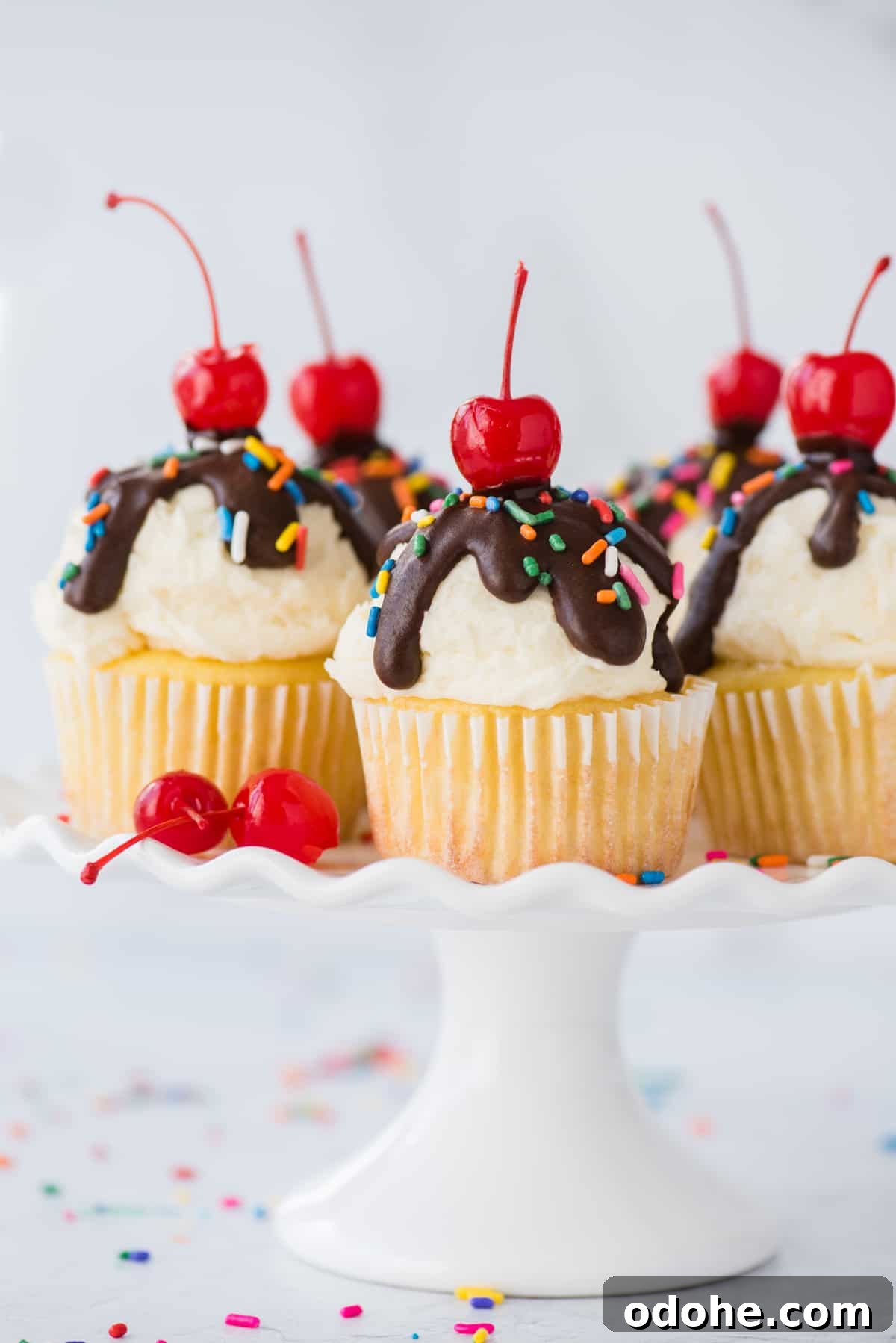 Ice Cream Cupcakes Recipe: Creamy No-Bake Dessert Cups 2 ice cream cupcakes displayed on white cake stand on white background