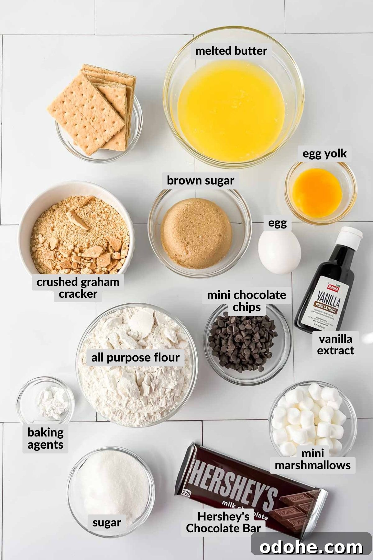 smores casserole ingredients in individual bowls.