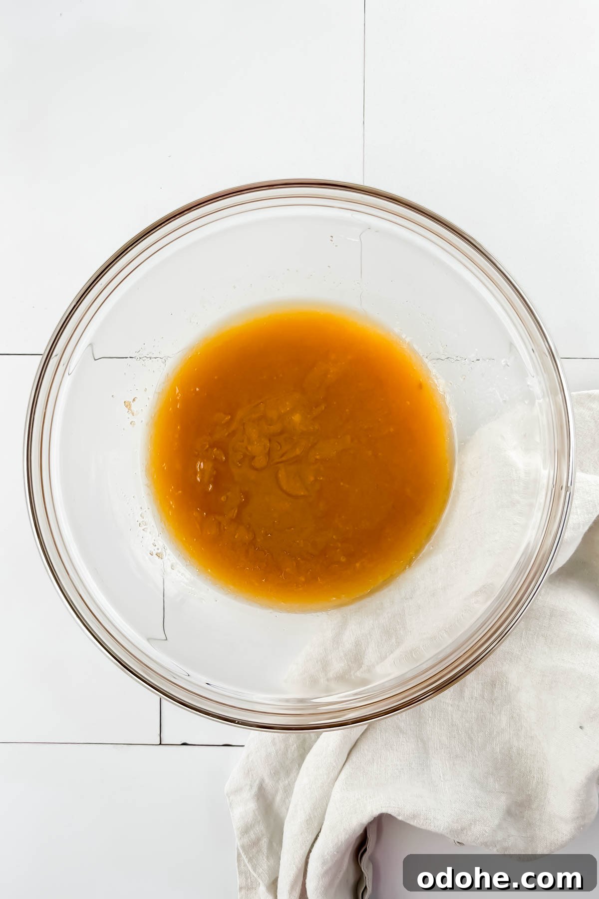 butter and sugar mixed in glass mixing bowl.