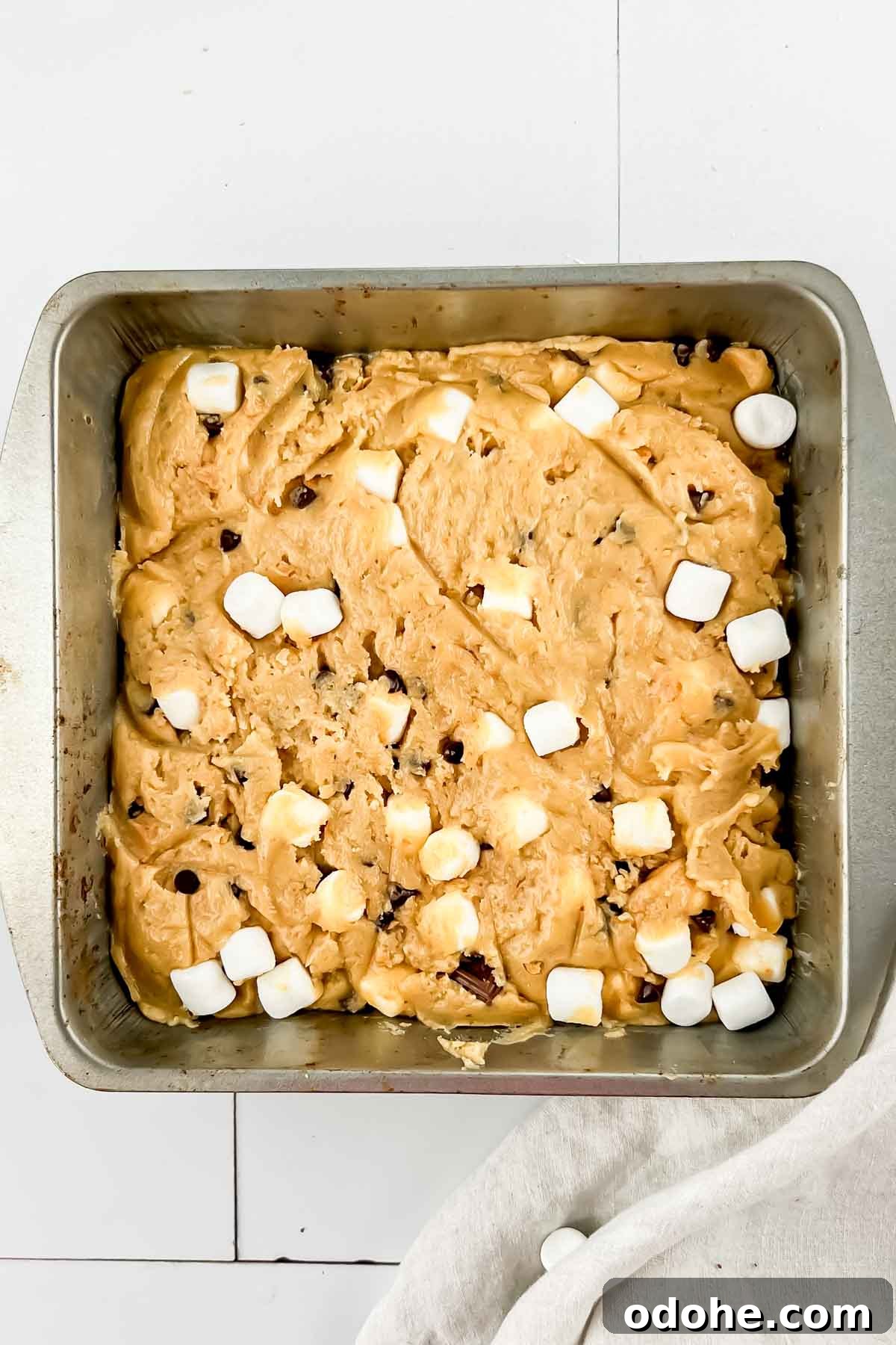 Smores casserole in square pan before baking.