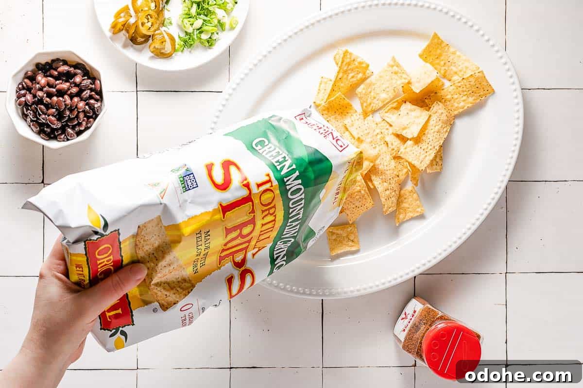 Crispy Spicy Queso Chicken Nachos Recipe 6 chips poured from bag onto platter