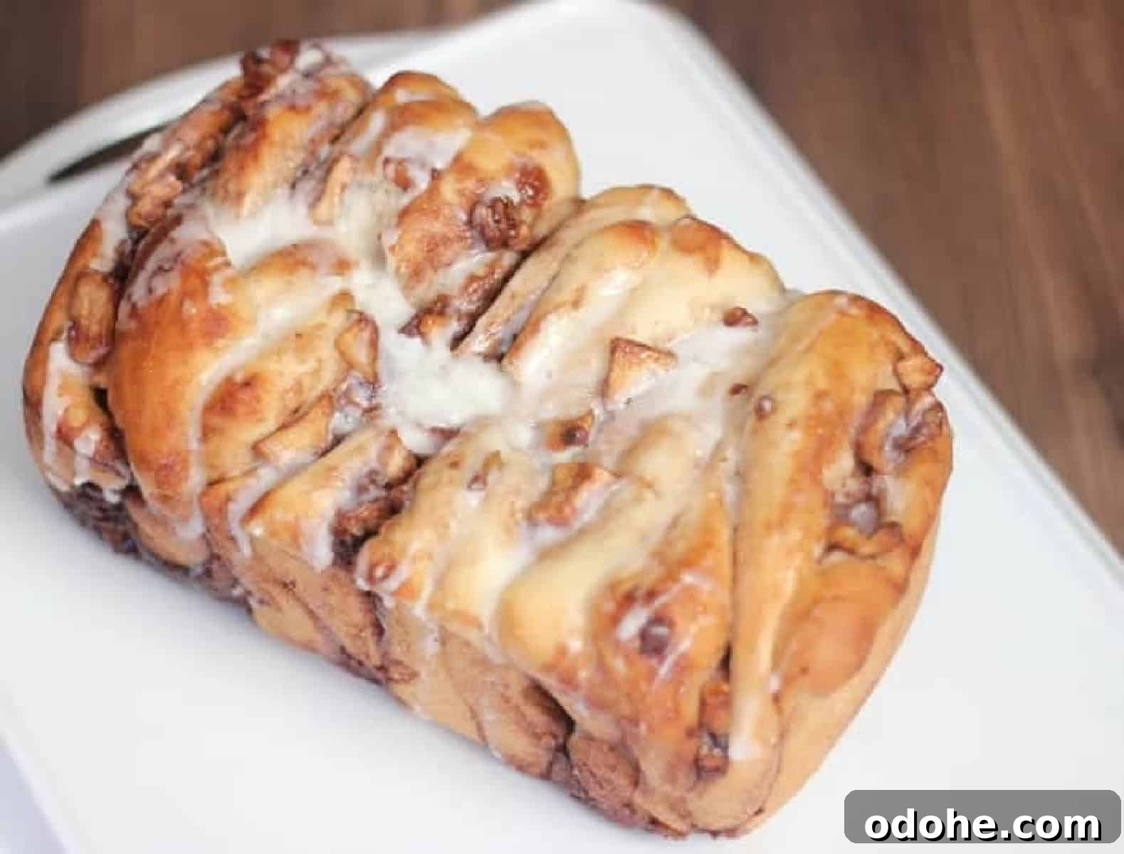Apple Cinnamon Pull-Apart Bread Recipe 2 Apple bread on white cutting board.
