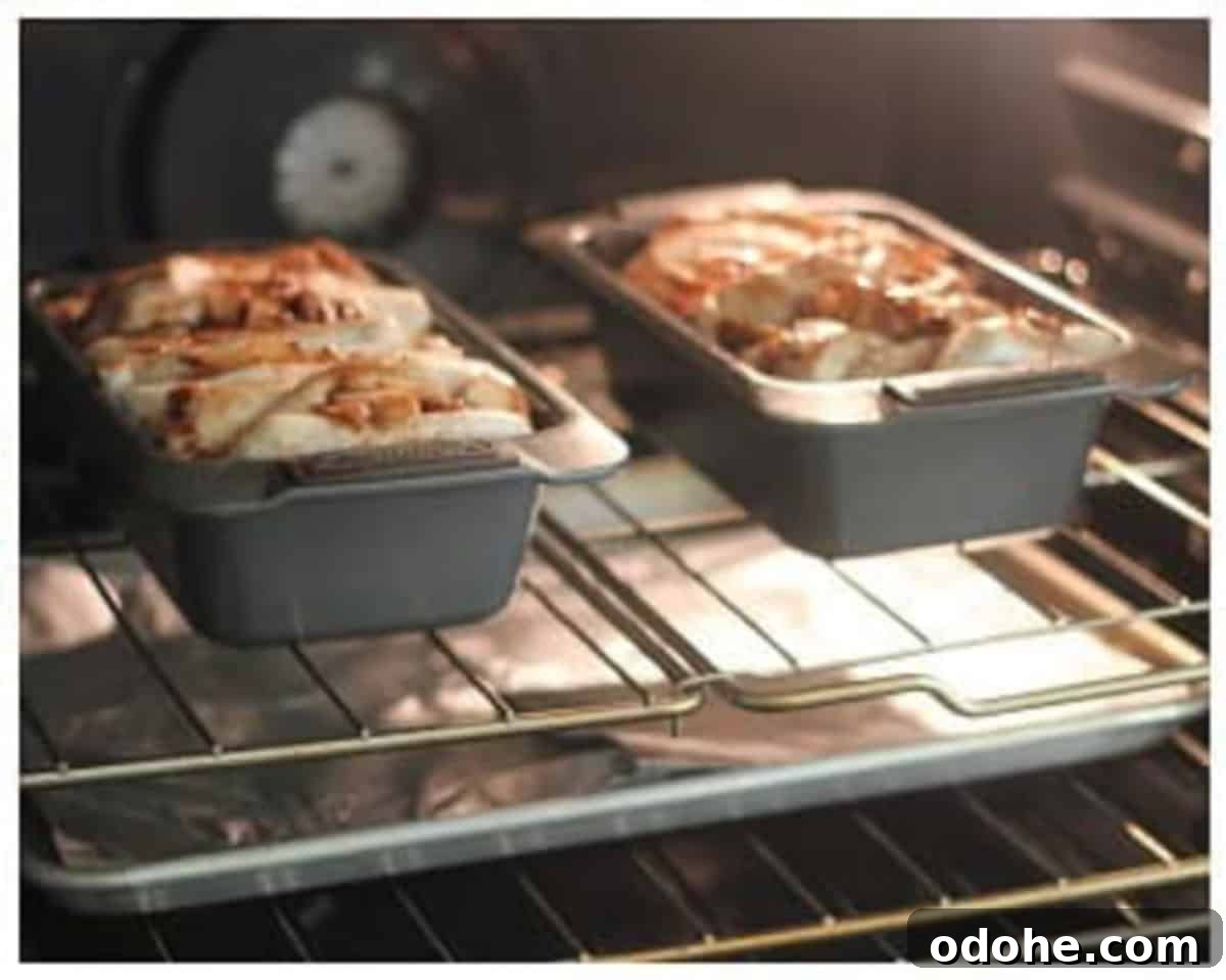 Apple Cinnamon Pull-Apart Bread Recipe 13 Two loaves of apple pull apart bread baking in oven.