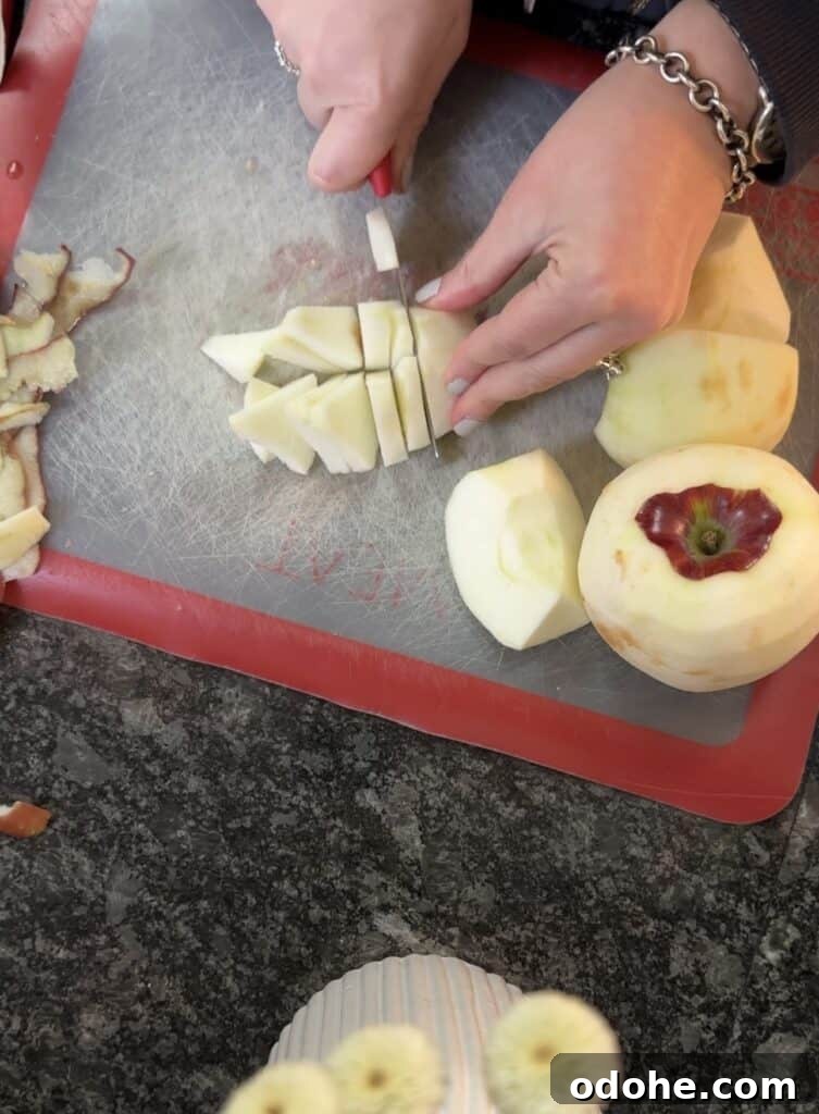cutting apple wedges into slices